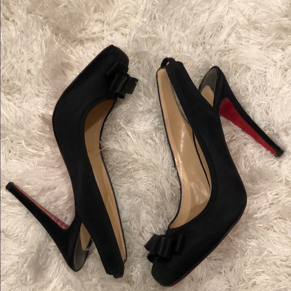 Black satin Louboutin slingback heels